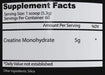 Supplement facts label with creatine monohydrate and silica on a black background