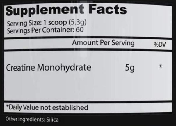Supplement facts label with creatine monohydrate and silica on a black background